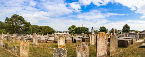 Panoramic view of the Stone graves at the Candie Cemetery at St Peter Port, Guernsey. St Peter Port, Guernsey - July 17th, 2018: Panoramic view of the Stone graves at the Candie Cemetery at St Peter Port, Guernsey. guernsey city stock pictures, royalty-free photos & images