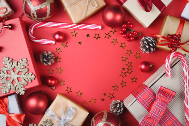 istock Christmas presents and accessories on red. 1079921236