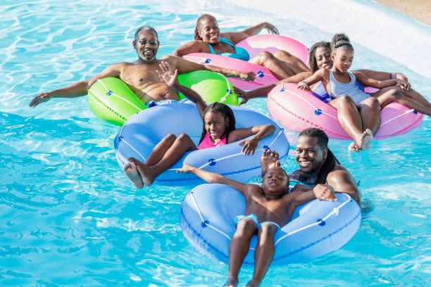 istock Multi-generation family at water park on lazy river 1079924672