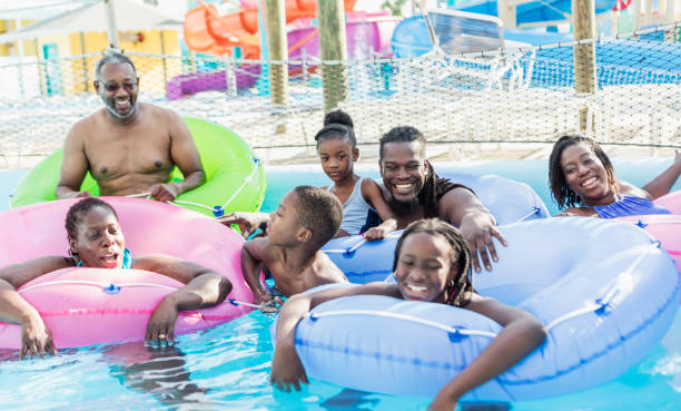 istock Multi-generation family at water park on lazy river 1079924790