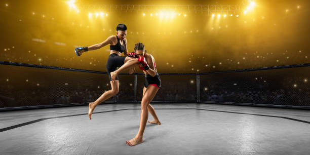 istock Female MMA fighters in professional boxing ring 1079938126