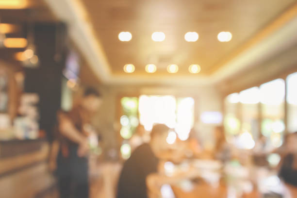istock Restaurant cafe or coffee shop interior with customer blur abstract vintage style bokeh light for montage product display background 1079938638