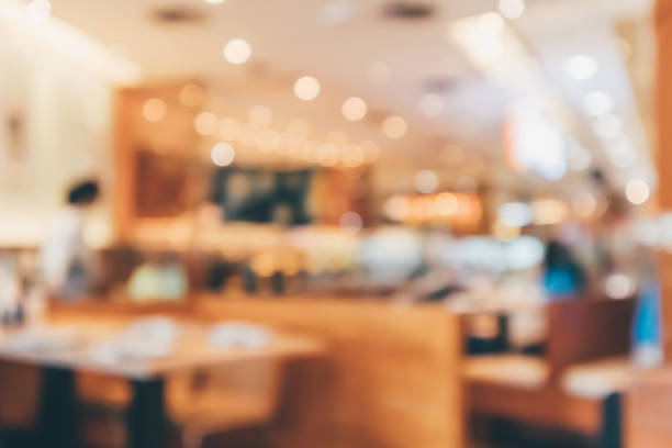 istock Cafe Restaurant interior with customer and wood table blur abstract background with bokeh light 1079938652