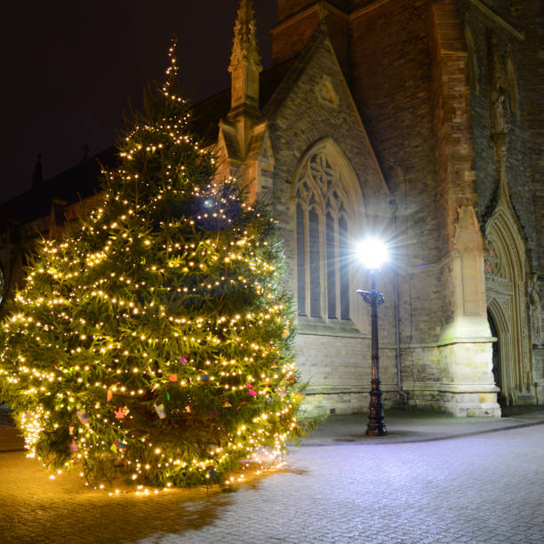 istock Old Church and Christmas Tree at Night 1079946836