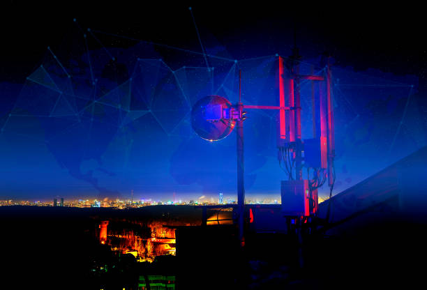istock Smart city and telecommunication technology network concept. Telecommunications tower, antenna and satellite dish and city at night as background 1079949888