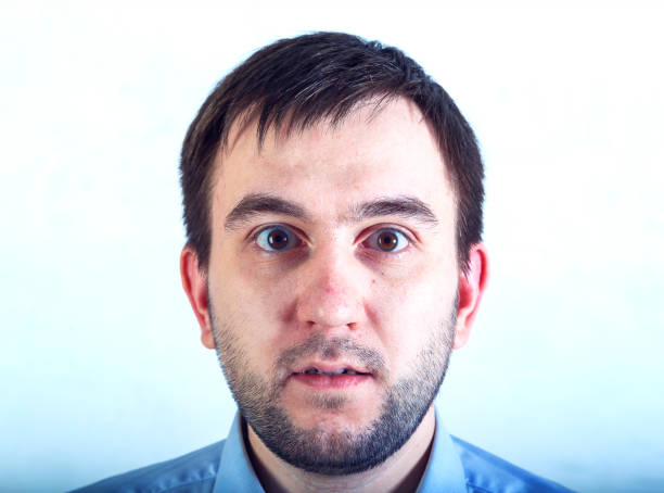 Surprised man with a beard with bulging eyes