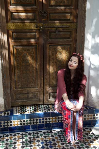 istock A hippie lady sat by a Moroccan doorway 1079954804