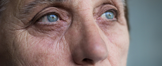 Eyes of a senior woman. Close up of senior woman face and eye