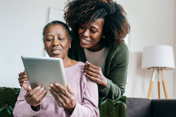 istock Assisted home and digital tablet for seniors 1079962614