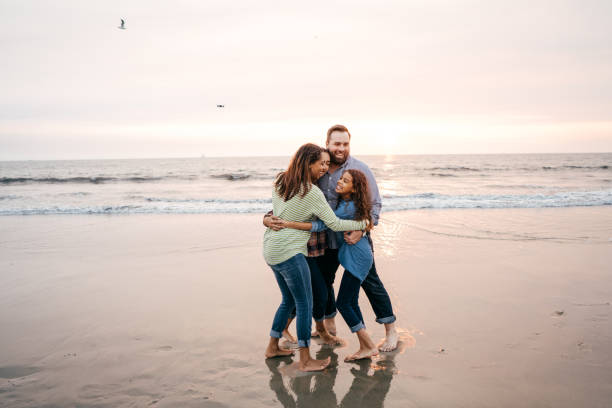 istock Sunset at the beach with family 1079962666