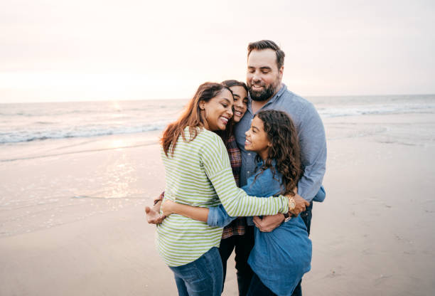 istock Sunset at the beach with family 1079962668