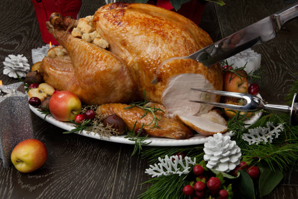 istock Carving Roasted Christmas Turkey with Grab Apples 1079963316