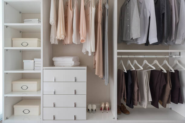 istock modern closet with clothes hanging 1079970486