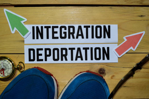 istock Integration or Deportation opposite direction signs 1079974276