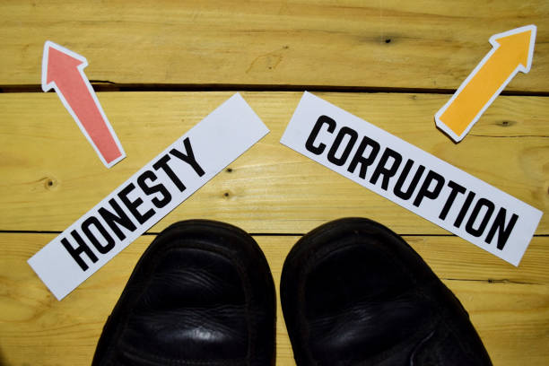 istock Honesty or Corruption opposite direction signs 1079975454