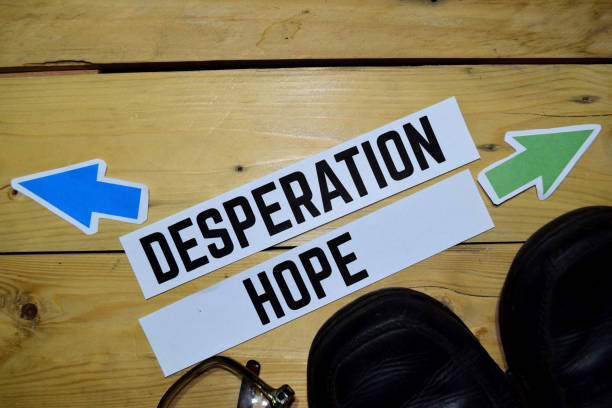 istock Desperation or Hope opposite direction signs with eyeglasses 1079975938