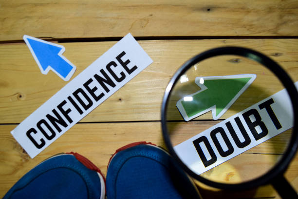 istock Confidence or Doubt opposite direction signs in magnifying 1079976966
