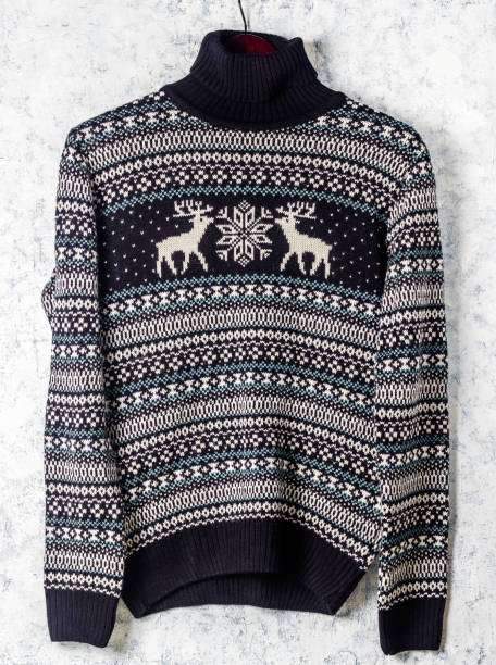 istock Warm black Christmas sweater with deers on hanger 1079981424