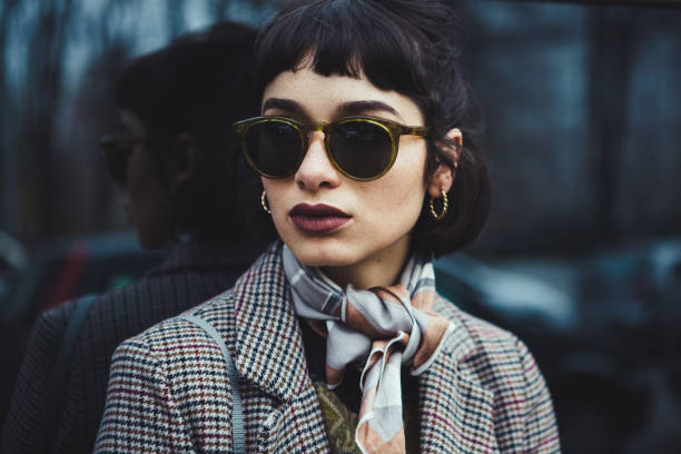 Winter portrait of a young woman in the city Portrait of a gen z woman in the city. lipstick photos stock pictures, royalty-free photos & images