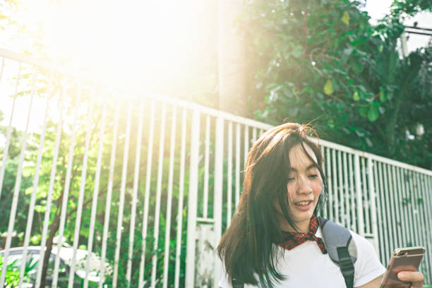 istock Pretty woman using smartphone for social network and traveler 1080007276