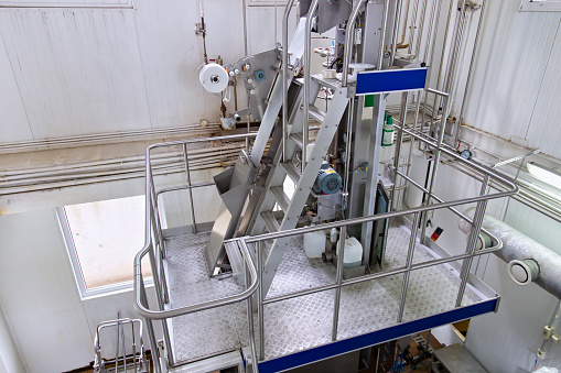 Industrial dairy production. View on the equipment on the milk factory.