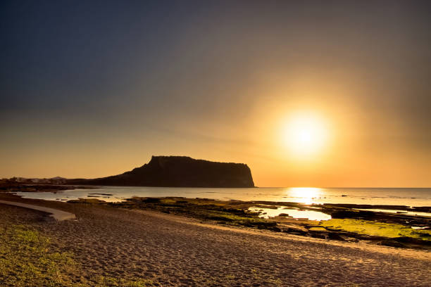 istock Sunrise on the beach VD702 1080035344