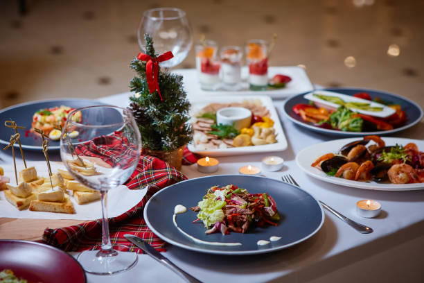 istock Romantic dinner setup or Holiday table setting. Many varied delicacies. Festive mood 1080041836