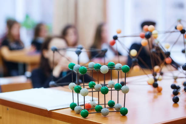 istock School children in a science class with a molecular model. Background image with soft focus. Education concept 1080044200
