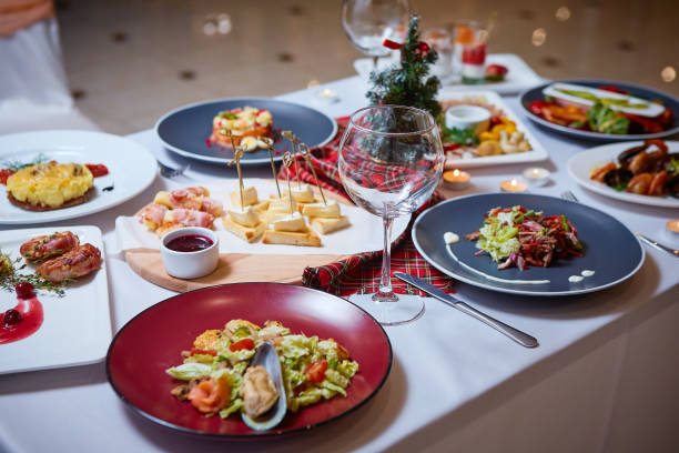 istock Romantic dinner setup or Holiday table setting. Many varied delicacies. Festive mood 1080047482