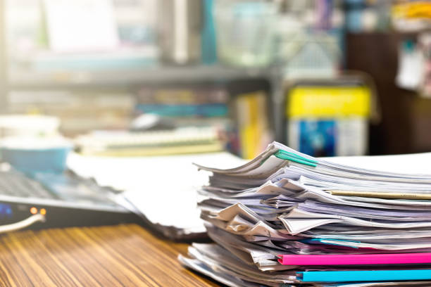 istock Pile of unfinished homework assignment documents on the teacher's desk 1080059950