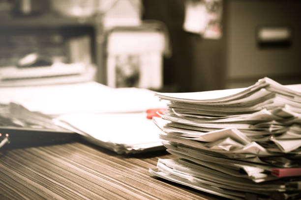 istock Pile of unfinished homework assignment documents on the teacher's desk 1080059982