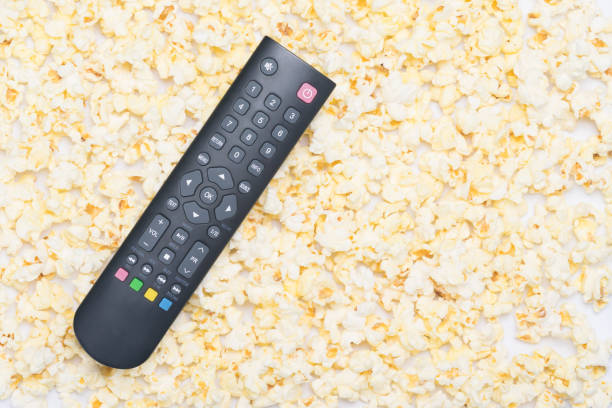 istock TV remote control is on the background of popcorn 1080060242