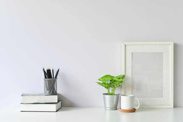 istock Office stuff with object supply books, coffee mug, pencil, photo frame and workspace table. 1080063806