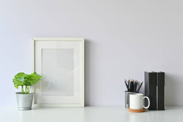 istock Office stuff with object supply books, coffee mug, pencil, photo frame and workspace table. 1080063834