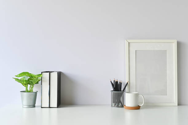 istock Office stuff with object supply books, coffee mug, pencil, photo frame and workspace table. 1080063984