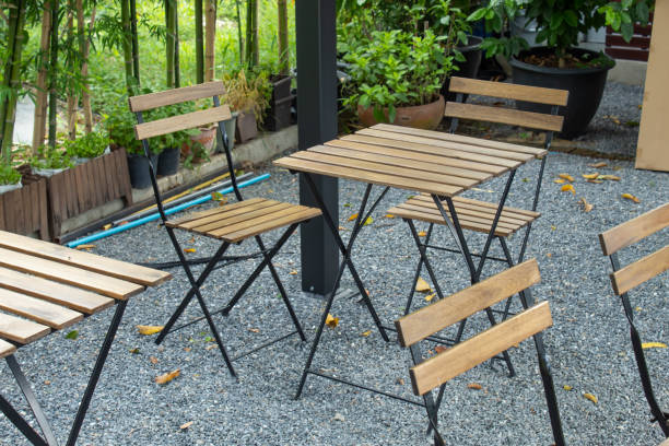istock Wooden table and chairs seating In the garden. 1080067006