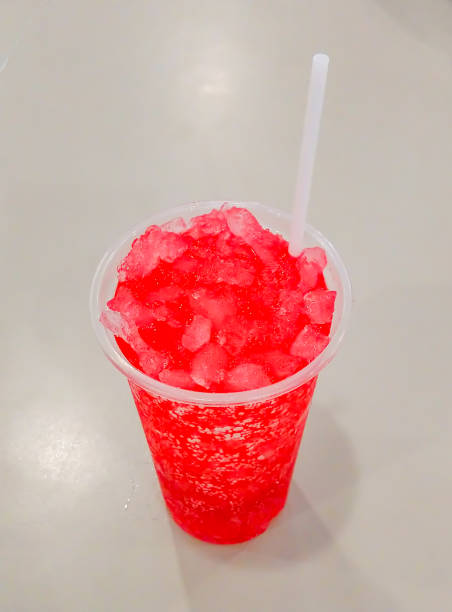 istock Red juice with ice in a plastic glass. 1080073688