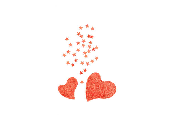 istock Two Living Coral hearts from sparkle isolated. 1080080694