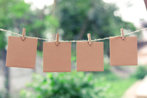 istock Note for text or picture on the rope and Tweezers bokeh background 1080081416