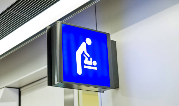 Baby changing sign in airport.