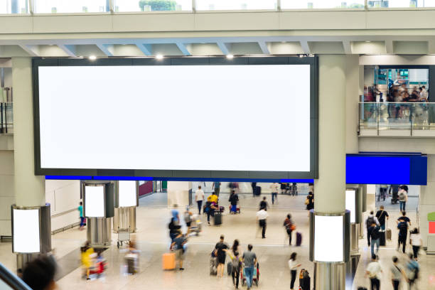 istock Blurred people and blank billboard in airport 1080085342