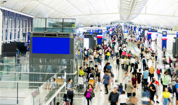 istock Blurred people walking in airport 1080085492