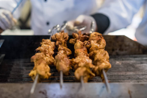 istock Chicken skewers on a grill 1080085546