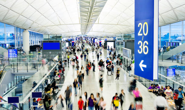 istock Blurred people walking in airport 1080085548