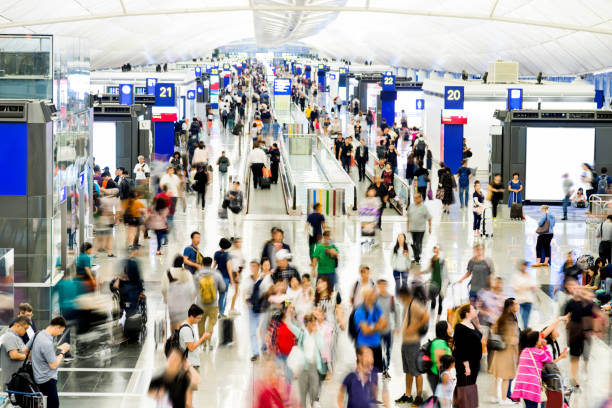 istock Blurred people walking in airport 1080085598