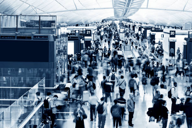 istock Blurred people walking in airport 1080085638