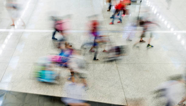 istock Blurred people walking in airport 1080086120