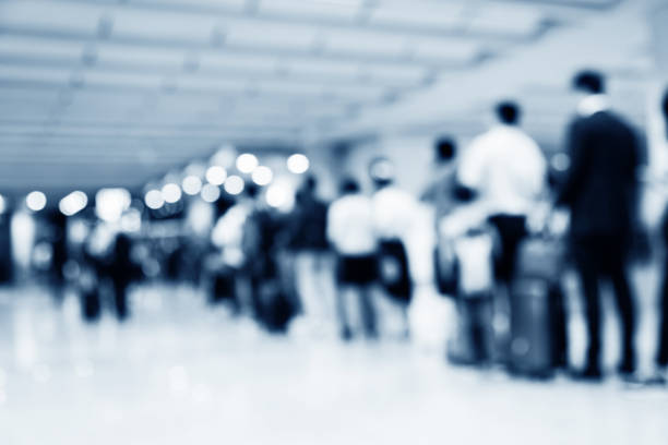People lined up and waiting in airport.