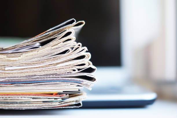 istock Newspapers and laptop 1080089288