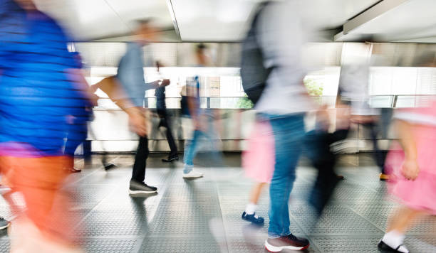 istock Blurred people walking in a corridor 1080091806
